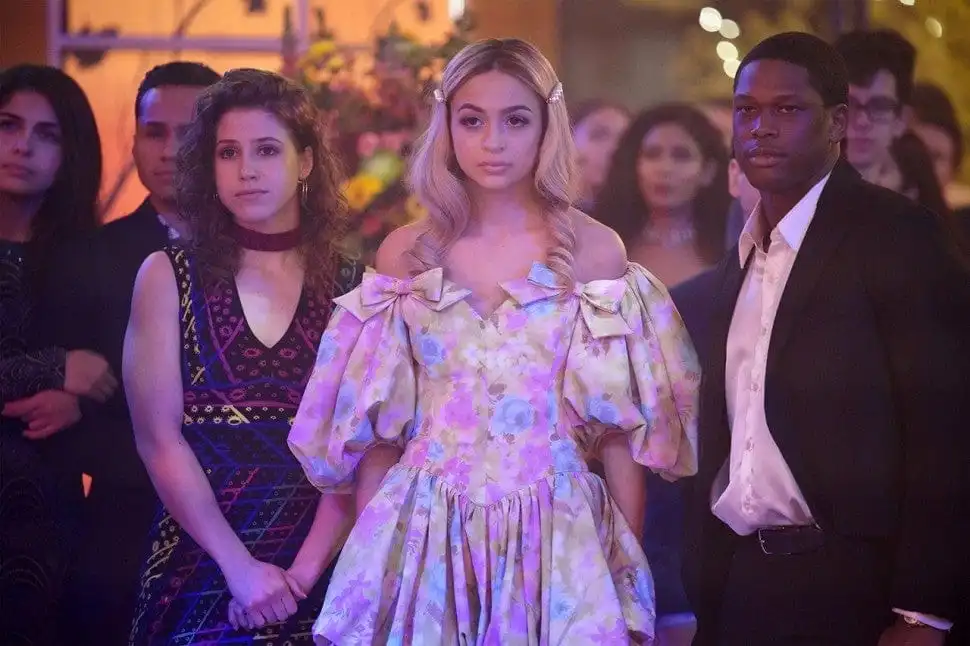 Josie Totah with two other Saved by the Bell characters standing at the front of a crowd