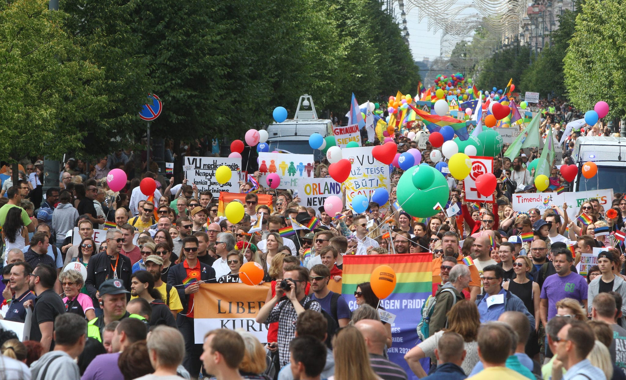 People hold flags and balloons as they take part in the Baltic Pride 2016 in Vilnius, Lithuania. 