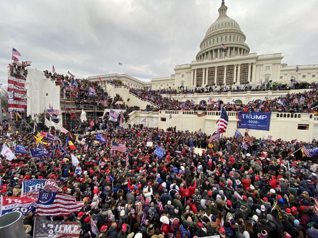 Violent rioters gather outside the Capitol building in Washington DC