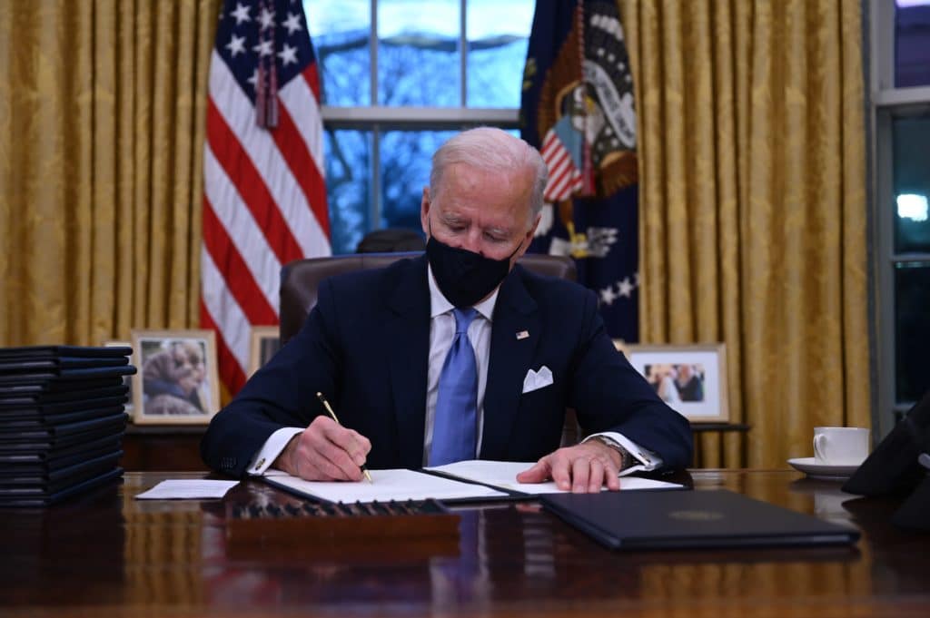 US president Joe Biden prepares to sign a series of orders in the Oval Office of the White House