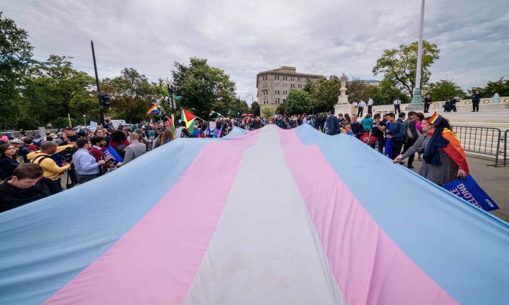 A giant trans flag unfurled outside the US Supreme Cour