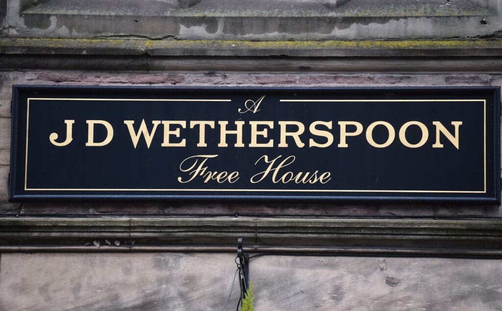 A close up of a Wetherspoons pub sign