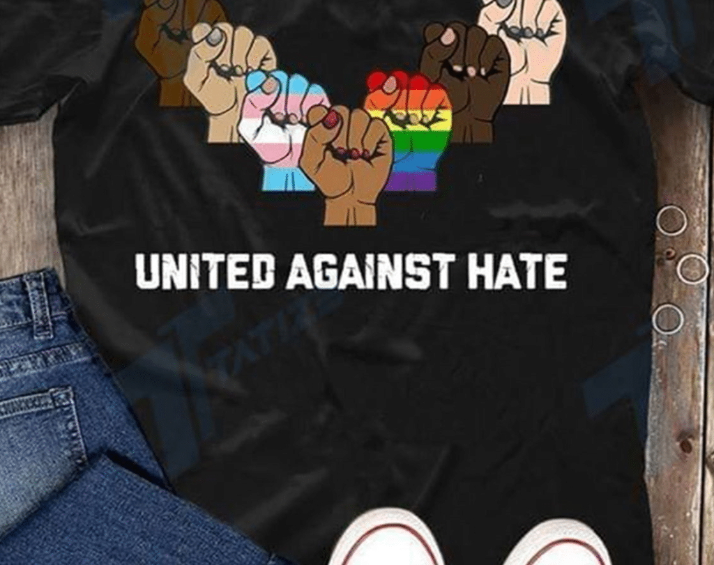 The United Against Hate top features the power fist graphic. (LightColorBoutique)
