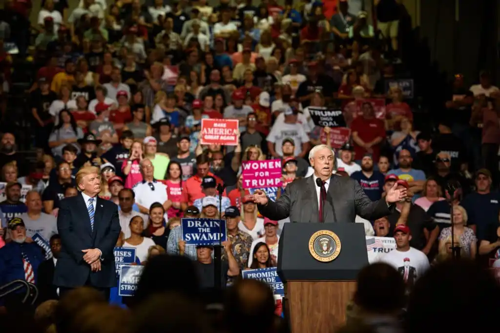 West Virginia governor Jim Justice announces that he is switching parties to become a republican as then-president Donald Trump listen at a campaign rally