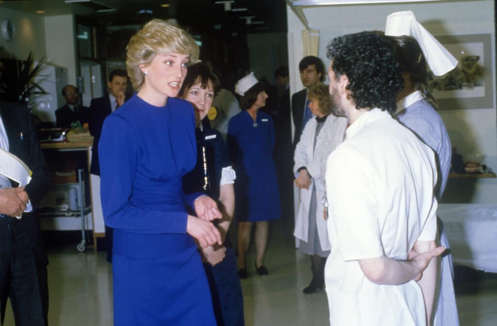 Princess Diana on a hospital ward talking to nurses
