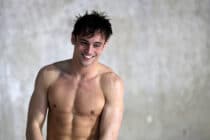 Tom Daley steps out of the pool shirtless