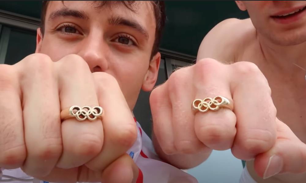 Tom Daley Matty Lee matching rings bearing the Olympic rings
