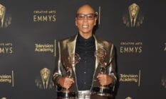 RuPaul on the red carpet at the creative arts Emmys holding his awards