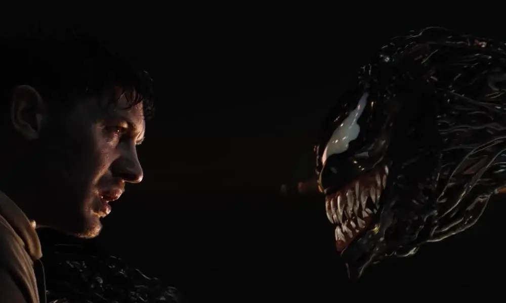 A still captured from the first Venom movie in which the main character Eddie Brock comes face-to-face with the symbiote Venom for the first time