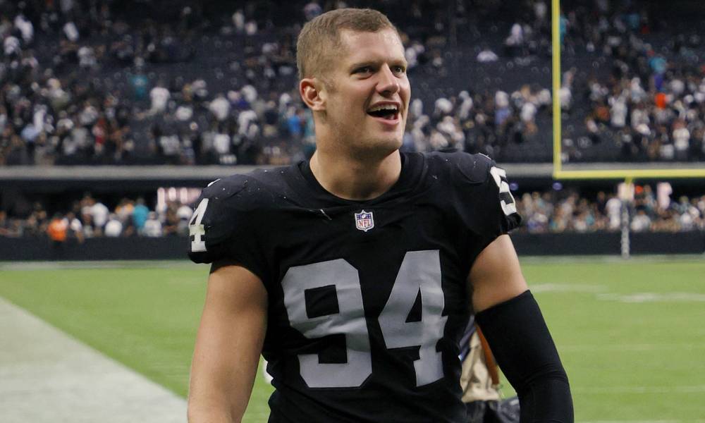 Carl Nassib of the Las Vegas Raiders celebrates as he walks off the field after the team's victory over the Miami Dolphins