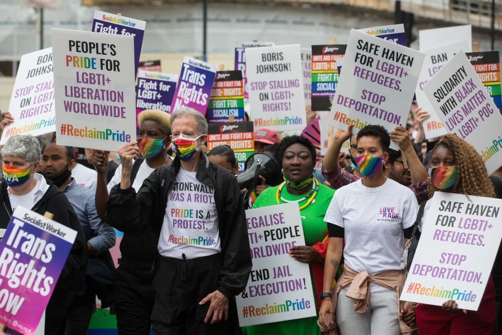 Peter Tatchell, flanked by Linda Riley and Phyll Opoku-Gyimah, leads thousands of LGBTI+ protesters along Whitehall on the first-ever Reclaim Pride march on 24th July 2021.