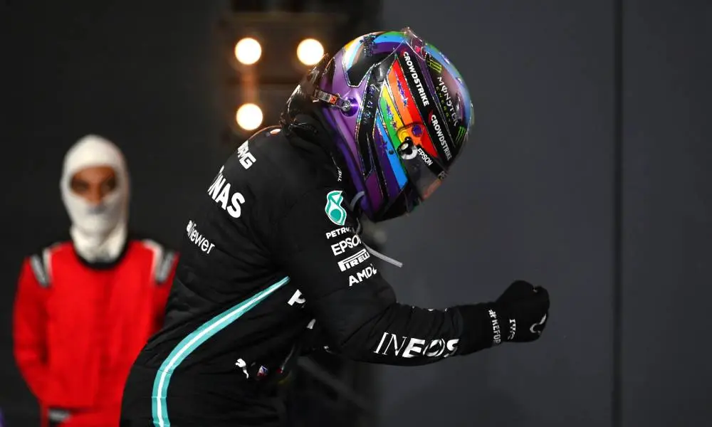 Lewis Hamilton wears a Pride helmet as he celebrates his win at the F1 Grand Prix of Saudi Arabia