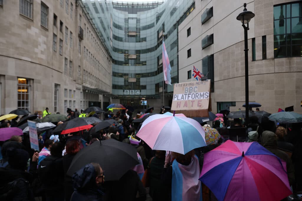 Trans rights protestors gather outside the BBC building