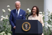U.S. Vice President Kamala Harris delivers remarks as U.S. President Joe Biden looks on in the Rose Garden of the White House on July 26, 2021.