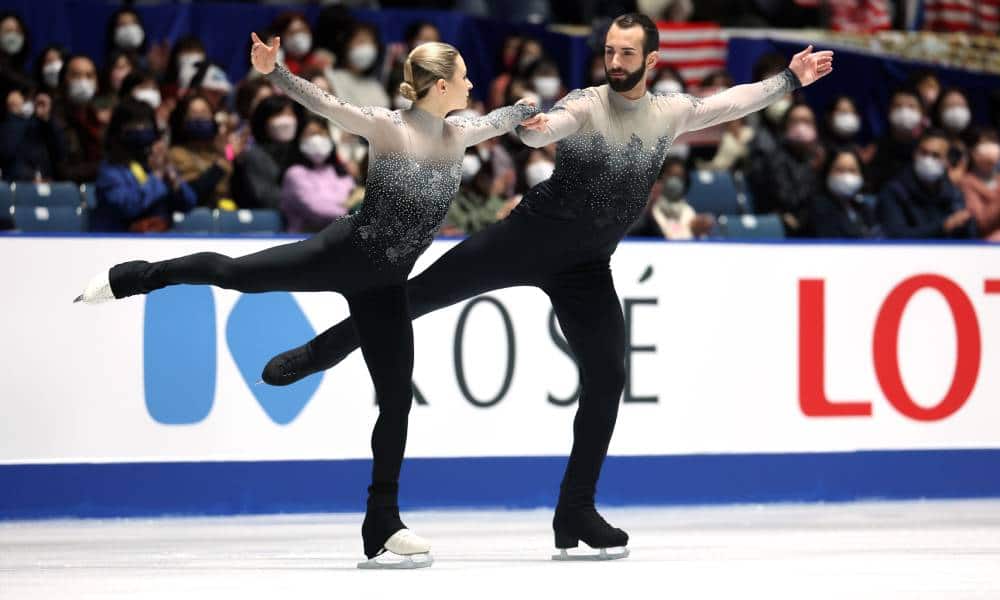 Figure skaters Ashley Cain-Gribble and Timothy LeDuc wear monochromatic ombre skating outfits while competing at the ISU Grand Prix of Figure Skating