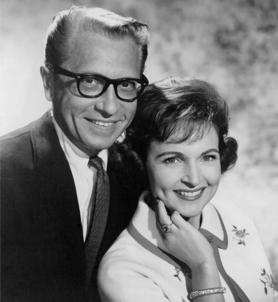 Betty White appears in a black and white publicity shot for gameshow Password in 1966 alongside her husband Allen Ludden