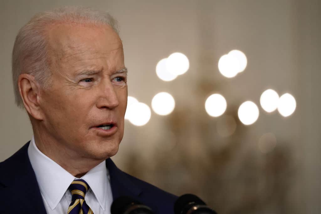 Joe Biden talks to reporters during a news conference in the East Room of the White House on January 19, 2022.