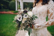 Bride holding flowers and wearing a wedding dress