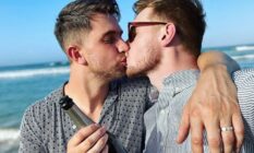 Max Parker and Kris Mochrie share a kiss on the beach