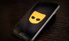 The Grindr app logo is seen on a mobile phone screen