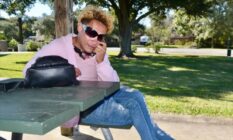 Martina Caldera sits on a park bench