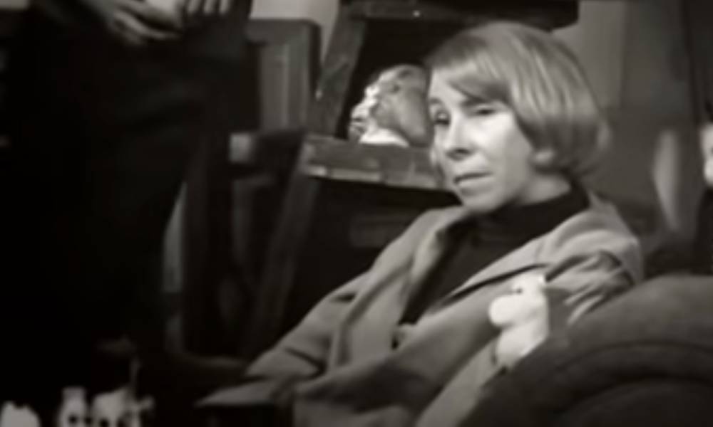 Tove Jansson, a white woman, lounges in a chair