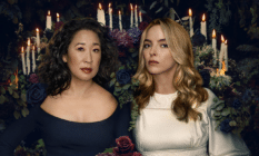 Eve and Villanelle in front of an array of candles