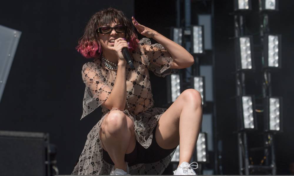 Charli XCX poses on stage during the Leeds Festival in 2019