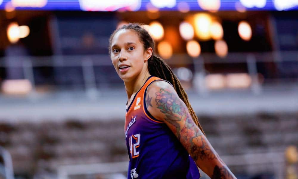 Brittney Griner wears a purple and orange Phoenix Mercury jersey during a basketball game