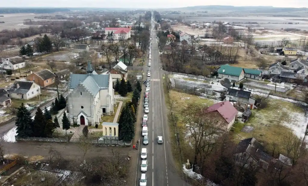This aerial picture taken on February 28, 2022 shows cars stuck in traffic as families fleeing the conflict drive towards the Medyka-Shehyni border crossing between Ukraine and Poland. 