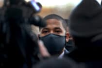 Jussie Smollett in front of several people and cameras