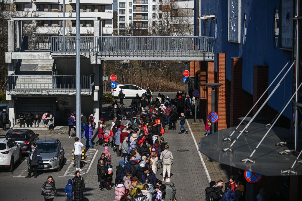 Hundreds of people who fled the war in Ukraine wait to enter the “Wardrobe of Good”, an initiative offering free clothes created in collaboration with IKEA, Strabag and Diverse on March 14, 2022 in Krakow, Poland. 