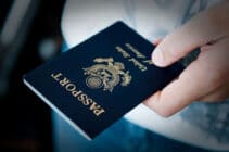 A hand holds a US passport
