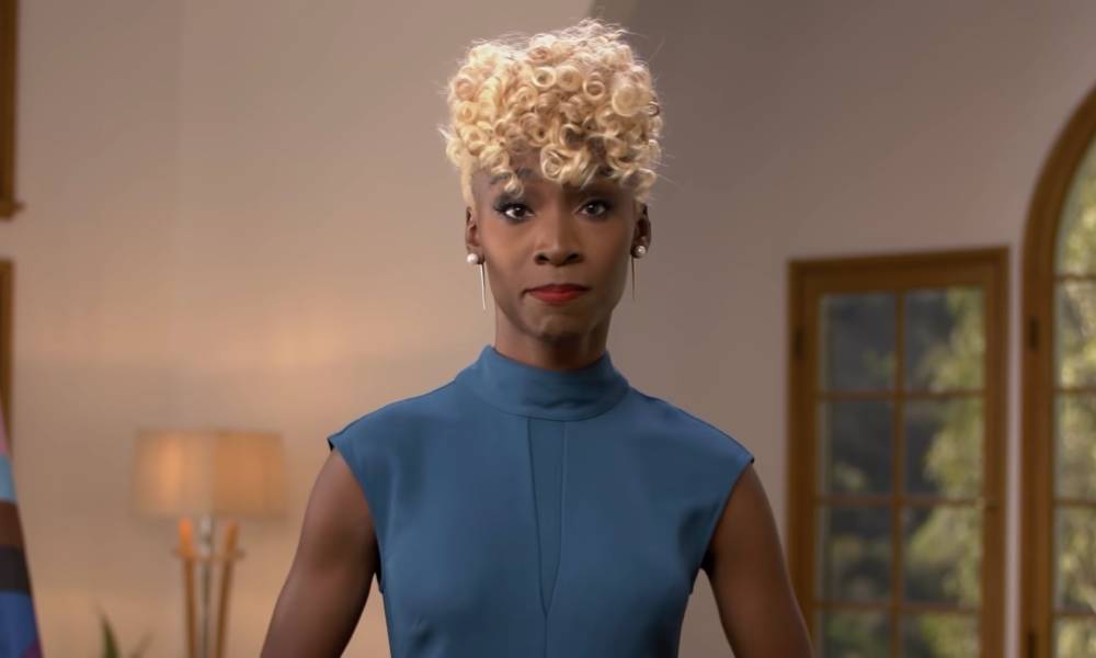 Angelica Ross, a Black trans actor and activist, wears a blue dress