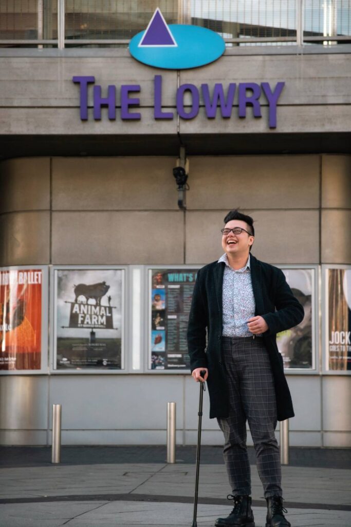 Julian Gray stands before the art gallery The Lowry