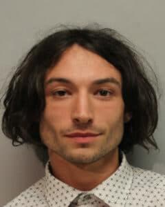 Ezra Miller's booking photo after their arrest for disorderly conduct and harassment