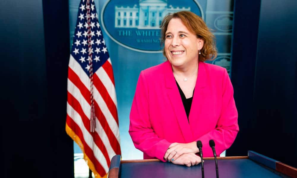 Jeopardy champion Amy Schneider wears a pink blazer and black outfit underneath as she visits the White House