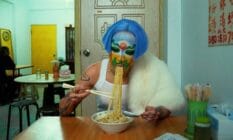 Non-binary artist Sin Wai Kin eats noodles during their film "A Dream of Wholeness in Parts"