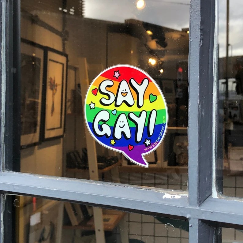 A "Say Gay" sticker. (sophiegreen/Etsy)