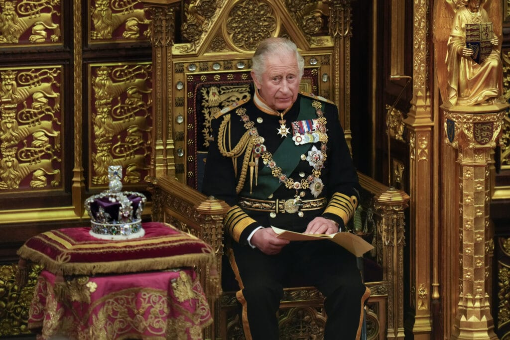 Prince Charles, Prince of Wales reads the Queen's speech next to her Imperial State Crown in the House of Lords Chamber