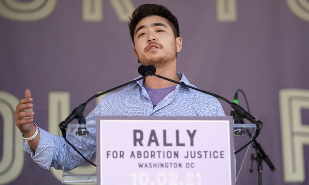 Schuyler Bailar speaks at a crowd gathered for the Rally for Abortion Justice