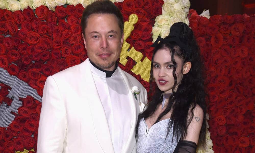 Elon Musk and Grimes pose for the camera as they attend the Met Gala