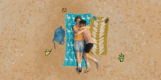 Still of Nick and Charlie hugging on the beach in Heartstopper