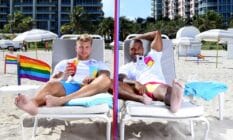Two men enjoy drinks on Miami Beach