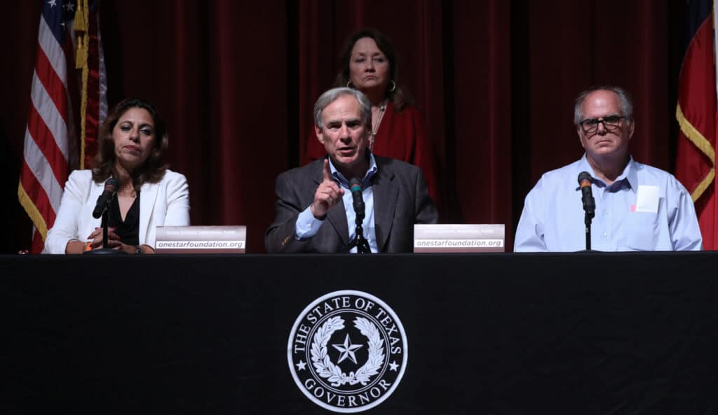 Greg Abbott speaks at a press conference 