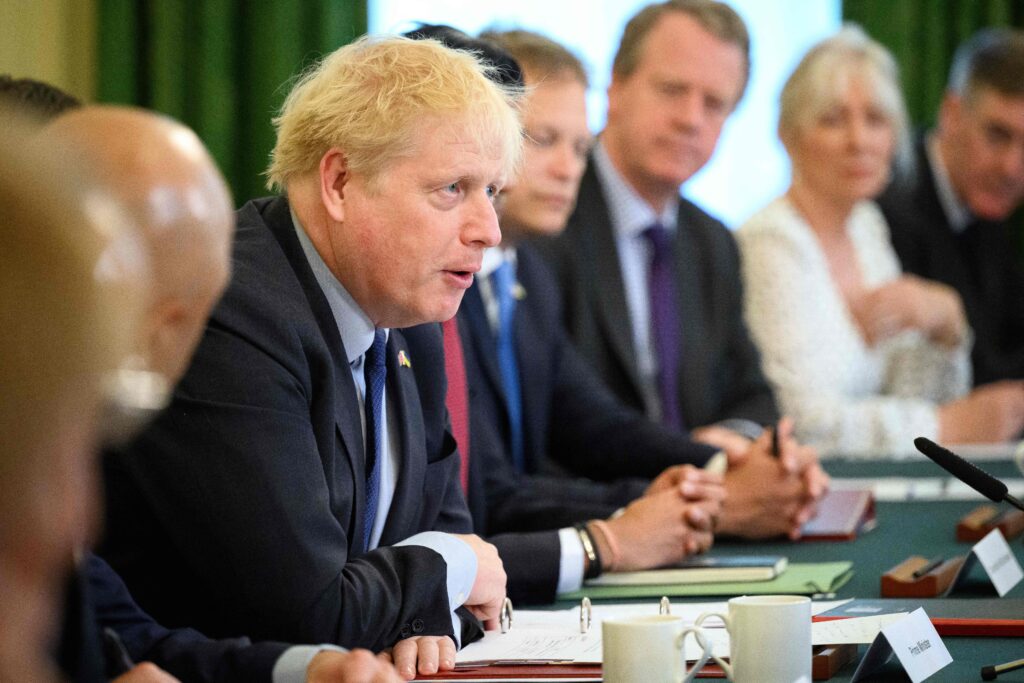 Boris Johnson (C) speaks as he chairs a Cabinet meeting 