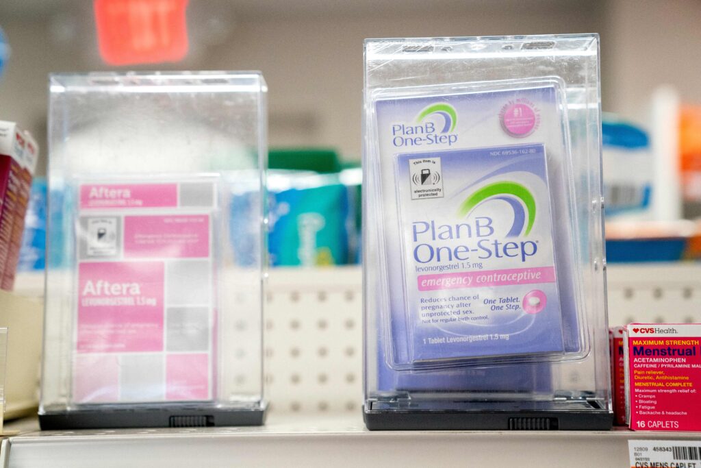 Plan B and Aftera sit locked on a shelf in a pharmacy in Washington, DC