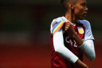Elisha N'Dow of Aston Villa adjusts a rainbow armband