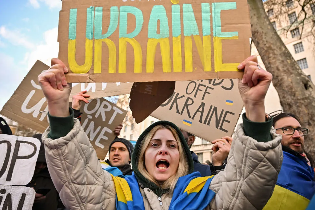 A Ukrainian holds a sign with an inscription "Ukraine" at a protest outside Downing Street against the recent invasion of Ukraine on February 24, 2022 in London, England.