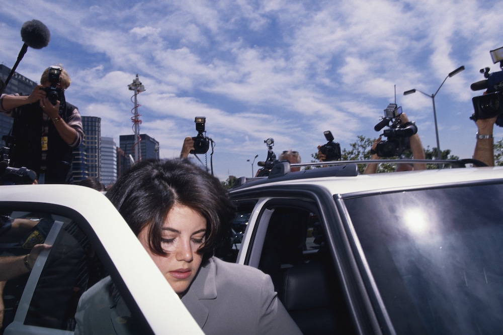Monica Lewinsky surrounded by photographers in May 1998